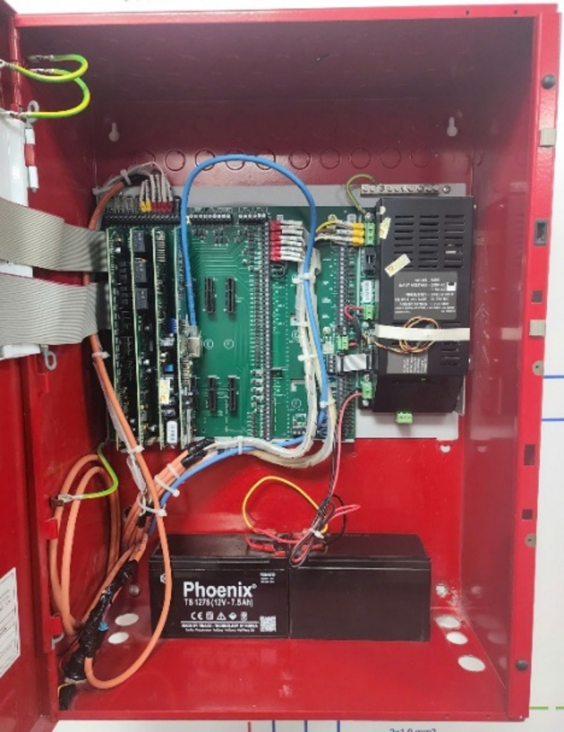 A red box with wires and circuit boards AI-generated content may be incorrect.