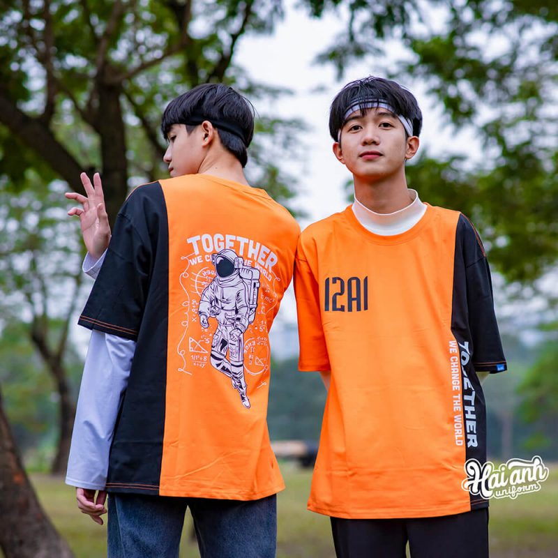 Mẫu áo lớp Colormix màu cam tươi slogan tiếng anh " 12A1 Together we change the world"