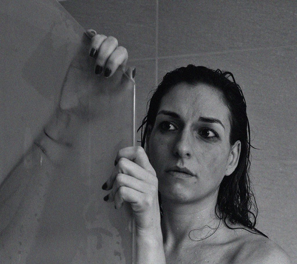 Woman with Anxiety Taking Shower to Help Calm Herself Down
