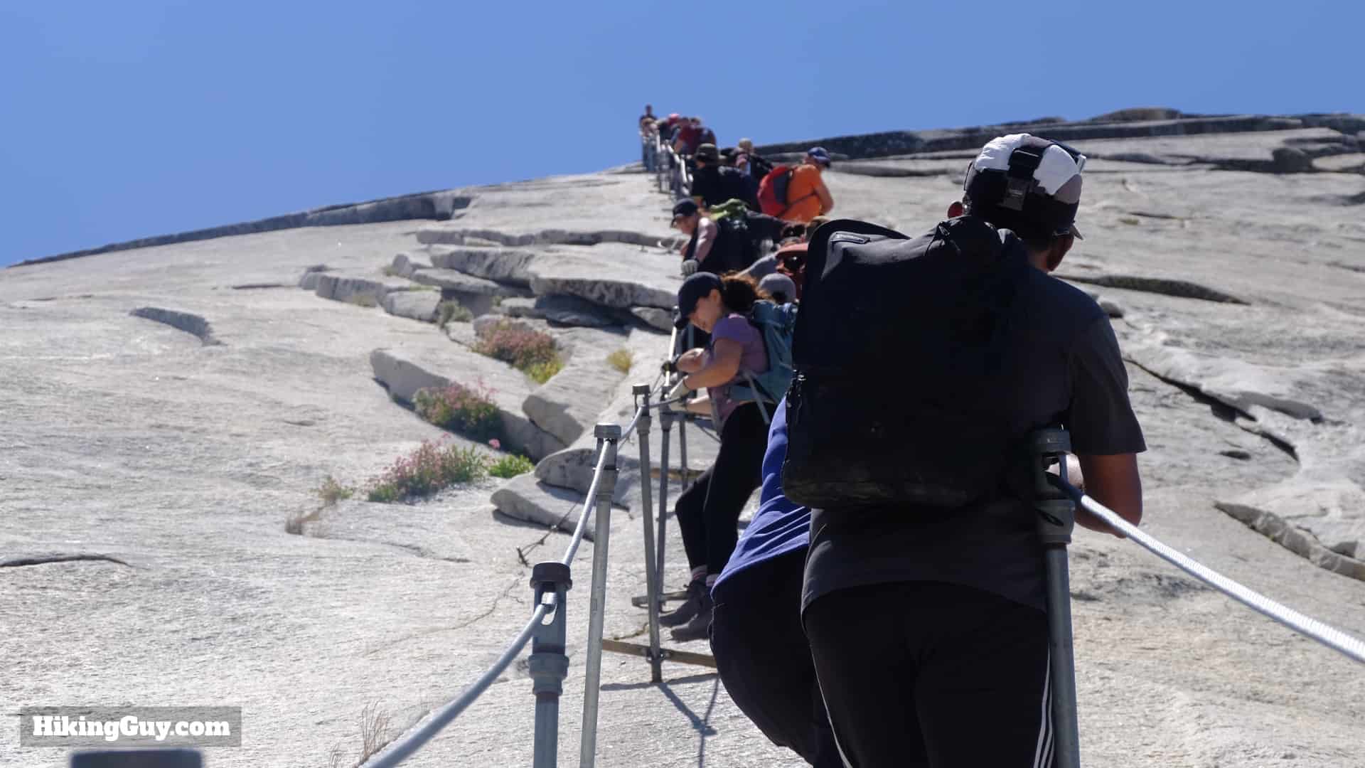 Hikers Considering The Half Dome Cables 2