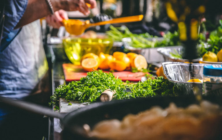 Multiple ingredients being prepared for batch cooking.