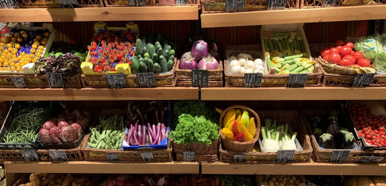 Multiple containers of fresh vegetables.