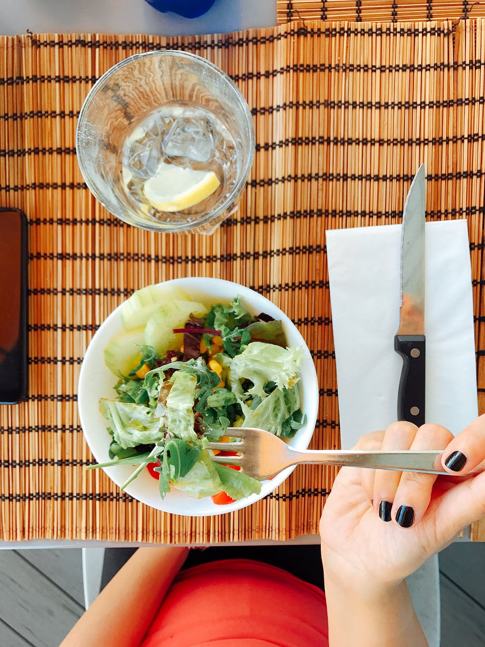 person eating a salad