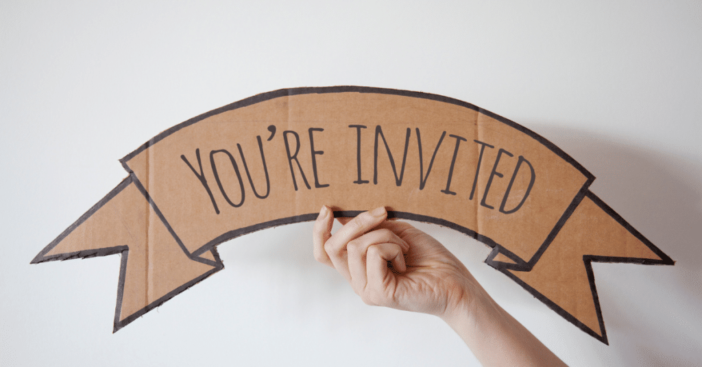 A sign that says 'You're Invited'. Improve your English skills with Oxford International English Schools.