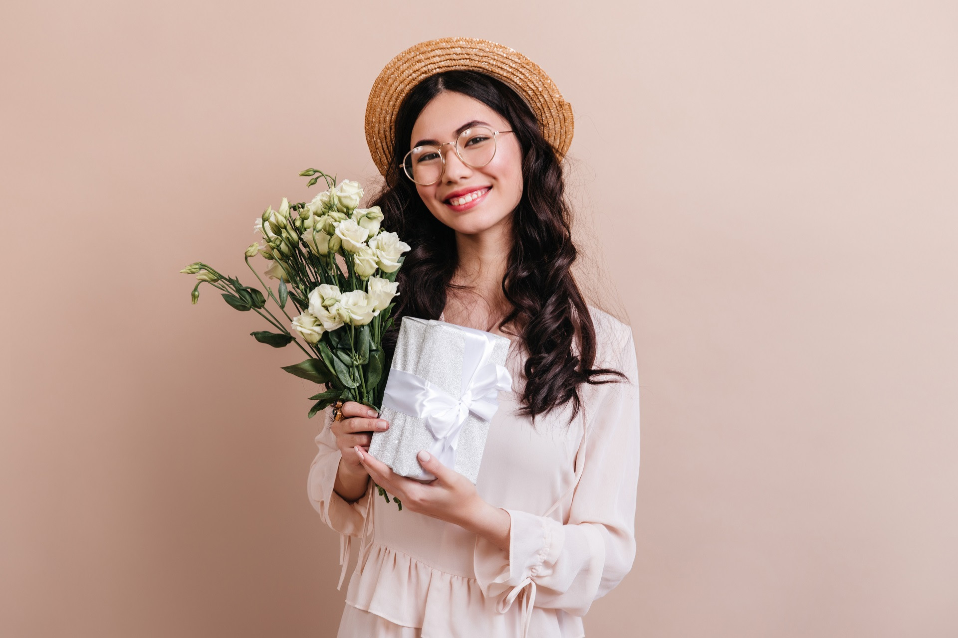 studio shot japanese woman with white flowers charming asian model holding eustoma bouquet gift.jpg